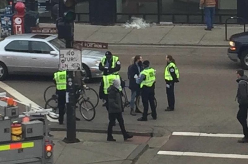 Police serve and protect by standing around in the street blocking traffic. Photo: @hurmsolo