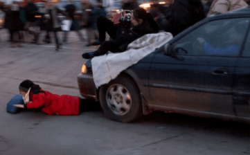 When a driver ran into a crowd of protestors in Minneapolis, injuring a 16-year-old girl, he was charged only with minor traffic offenses. Photo: KTSP