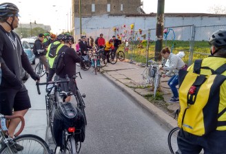 cyclists visit the "ghost bike" memorial for Bobby Cann at the crash site near Clybourn/Larrabee. Photo: Active Trans