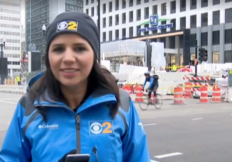A close examination of CBS footage shows the cabbie (behind reporter) may have blown a red light. This screen shot shows the north-south Walk signal was activated just before the collision. Image: CBS