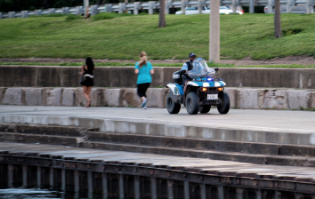 A police officer drives an ATV on the Lakefront Trail. Photo: Milosh Kosanovich