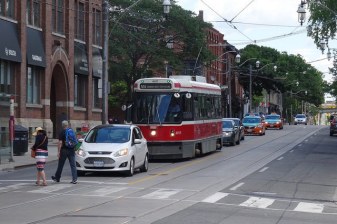 Currently, streetcars get bogged down down in private car traffic on King Street, Toronto's busiest surface transit route. A new plan would divert private vehicles out of the path of transit. Photo: booledozer/Flickr