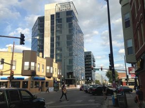 Some affordable housing activists say upscale developments like the "MiCa" towers near Logan Square's California Blue Line stop, geared towards people who don't want to have to own a car, are accelerating the displacement of longtime residents. Photo: John Greenfield
