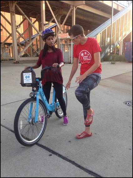 Bicycling
Ambassador Emme Williams demosntrates the "power start" cycling technique at an adult cycling class at Kennedy King College last year. Photo: CDOT