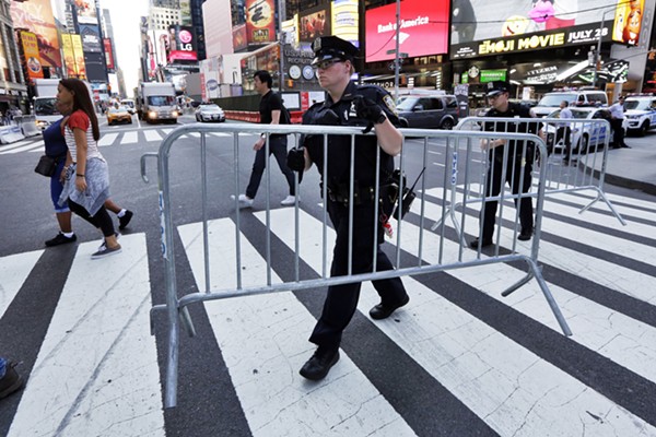 Following a vehicle attack in May, New York City police installed metal fences and concrete barriers along blocks of Times Square. Photo: Richard Drew / AP