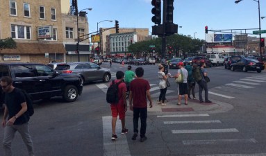 The city plans to join this "pork chop" island at the northwest corner of Division/Milwaukee/Ashland to the sidewalk by installing pain and posts, eliminating the slip lane. Photo: CDOT