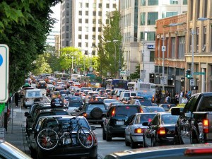 If cities don't act decisively to prioritize bus and rail service, more riders will switch to ride-hailing in a vicious cycle of increasing traffic and declining transit quality. Photo: Oran Viriyincy/Flickr