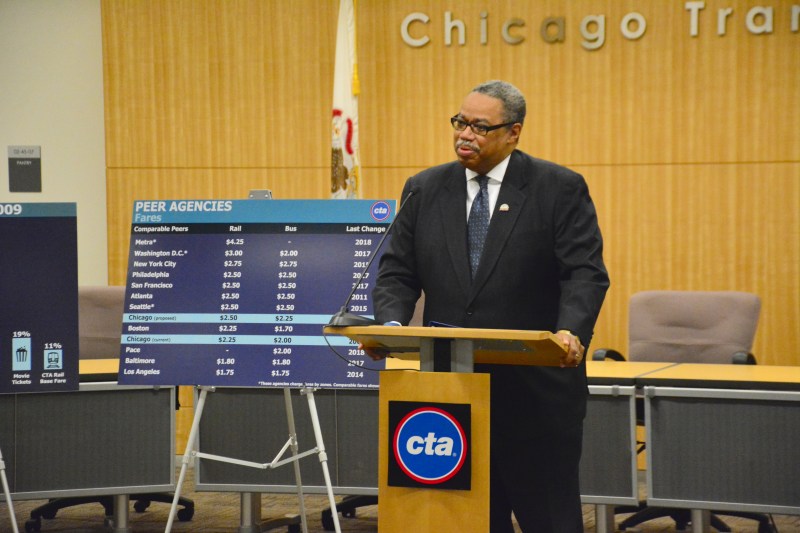 CTA president Dorval Carter announced the fare hikes this afternoon at the CTA headquarters, flanked by a chart that shows that most other major U.S. transit systems currently have higher fares. Photo: CTA