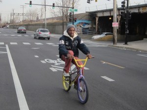 Robert Calvin rides in Chicago's Austin neighborhood. 264 bike tickets were written in the community last year, compared to only five in Lincoln Park. Photo: John Greenfield