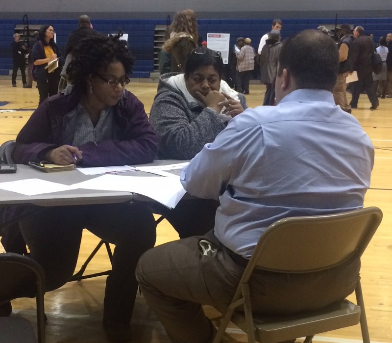 Attendees look over plans for the Red Line extension. Photo: James Porter