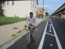 Housepainter James Woods rides in the Lake Street protected bike lane on the West Side soon after it was installed several years ago. Conditions have degraded significantly since then. Photo: John Greenfield
