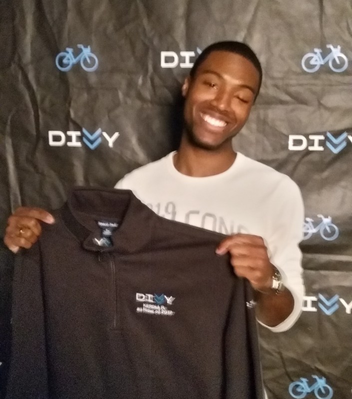 Divvy gave Kerdia Roland a custom sweater that says "#1 Rider in 2017".