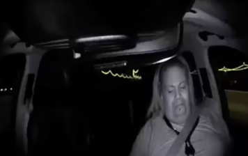 A video still released by Tempe police from inside the Uber car shows the backup driver with her eyes off the road before the collision that Elaine Herzberg.