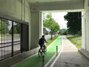 A cyclist rides towards the lake on a Lawrence underpass bike lane. Photo: John Greenfield