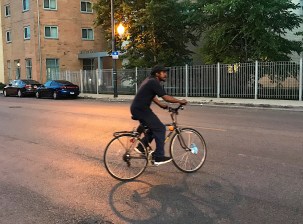 Johnny Harris rides a bike in North Lawndale. Photo: John Greenfield
