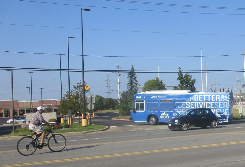 A Niles Free Bus Route 412 bus turns onto a mall parking lot. Photo: Igor Stdentkov