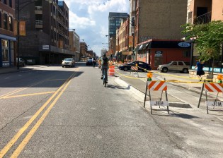 New curb and concrete island construction on Milwaukee Ave. between Erie and Sangamon.