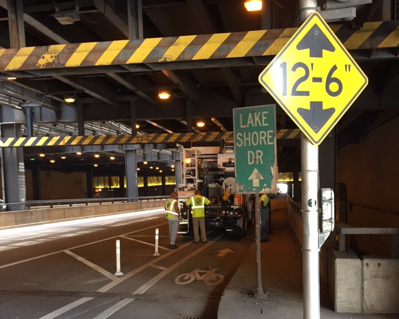 Workers put the finishing touches on the Middle Randolph bike lanes. Photo: Anne Alt