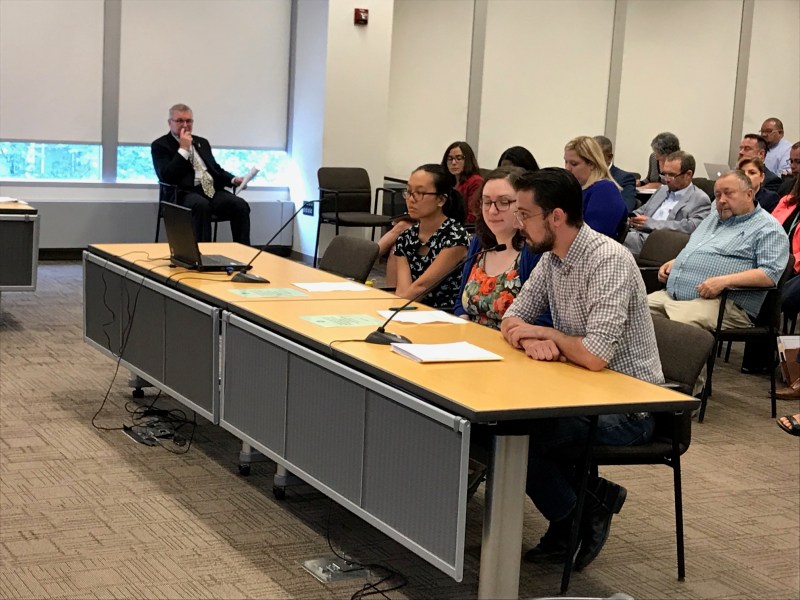 Debbie Liu, Julia Gerisamenko, and Quade Gallagher asked CTA board members to save the 31st Street bus at this morning's meeting. Photo: John Greenfield