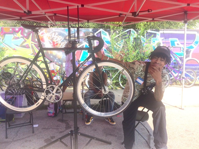 AD, a veteran of Blackstone Bicycle Works youth programs who now works as a mechanic, at Blackstone Summer. Photo: James Porter