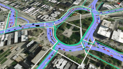 Screen shot of CDOT's traffic simulation of the recommended design for the traffic circle. Green lines represent bike routes and white lines represent pedestrian routes.