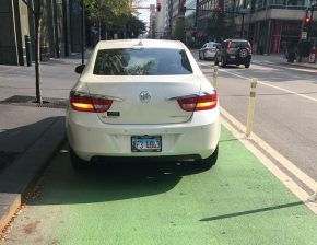 Ride-hailing drivers often park in bike lanes downtown, the most common place for trips to begin and end. Photo via Bike Lane Uprising.