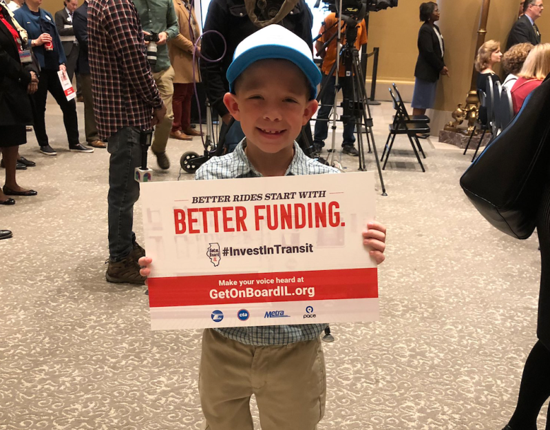 A young transit funding supporter at today's press conference. Photo: RTA