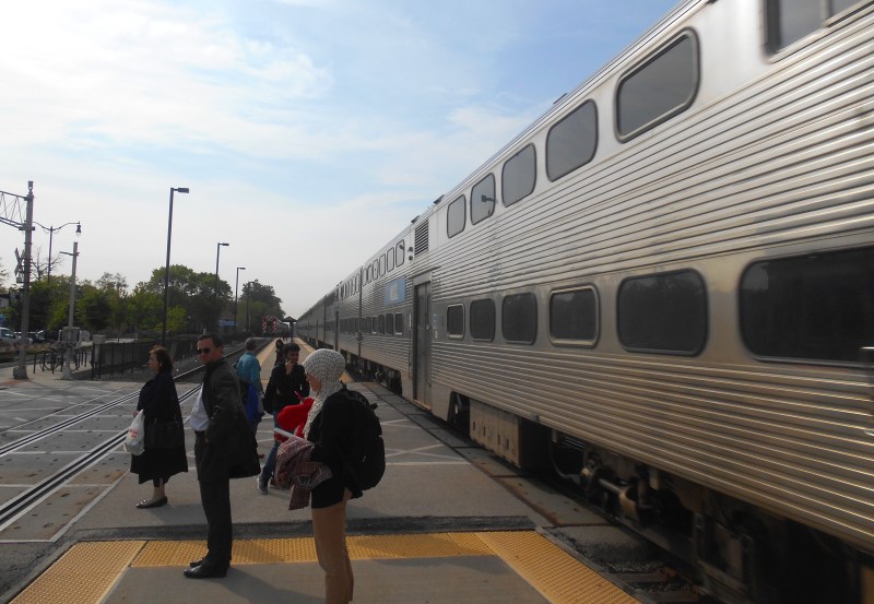 A Union Pacific Northwest Line outbound express train races past Des Plaines station. This summer the line will see express trains on weekends as Metra hopes to encourage more ridership. Photo: Igor Studenkov