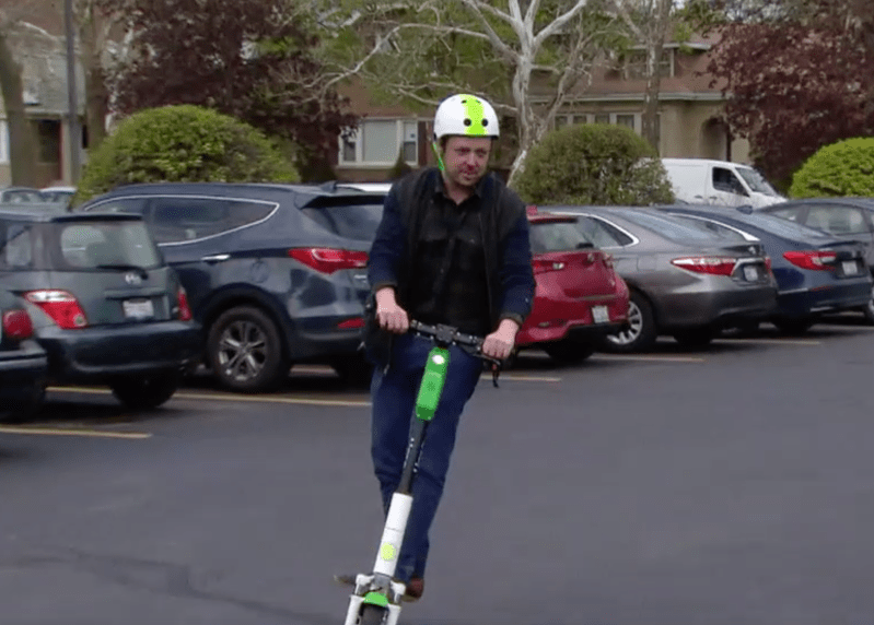 Test-riding a scooter in Chicago. Image: WTTW