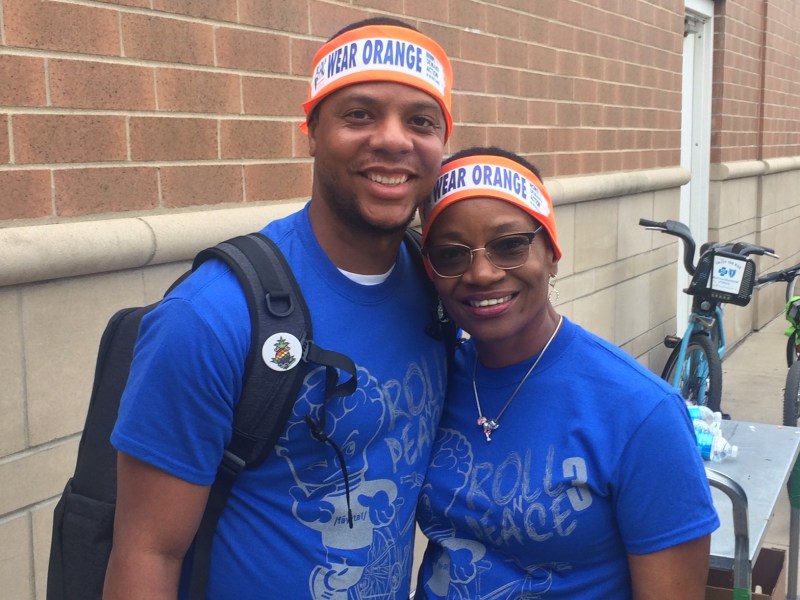Mark Thompson of Teamwork Englewood and Deborah Payne from Oak Street health wear orange headbands to raise awareness of gun violence and honor the victims. 500 of the headbands were distributed at the ride by the anti-violence organizations Moms Demand Action & GPac. Photo: James Porter