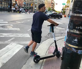 A scooter rider in Logan Square. Photo: John Greenfield