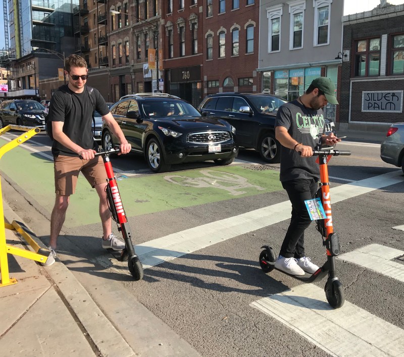Scooter riders on Milwaukee Avenue in River West. Photo: John Greenfield
