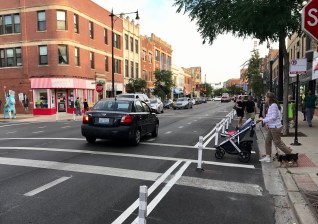 Paint-and-post sidewalk extensions shorten crossing distances. Photo: John Greenfield
