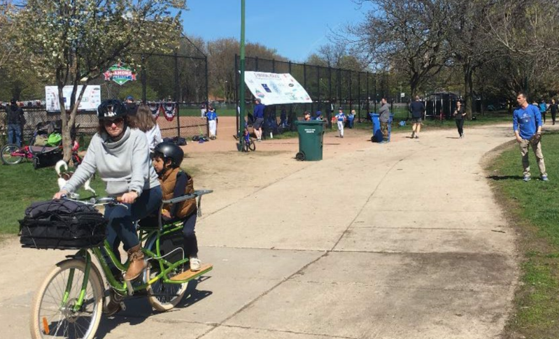 Biking on the path through Oz Park that would be part of the Dickens Greenway. Photo: CDOT