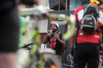 Olatunji Oboi Reed kicking off a Slow Roll Chicago ride in the Marquette Park neighborhood on the Southwest side of Chicago in August of 2015. Photo: Michael Bracey