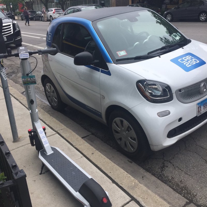A Car2go vehicle (and a dockless electric scooter) in Wicker Park. Photo: Courtney Cobbs