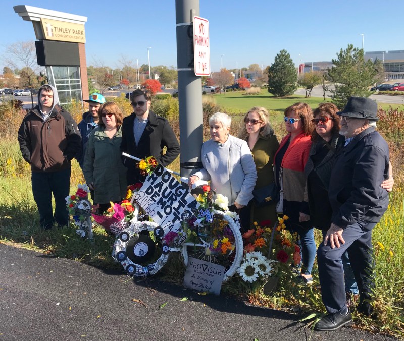 Douglas DeMott's family with the ghost bike. Photo: John Greenfield