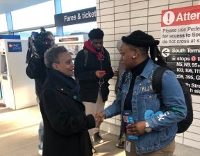 Lightfoot greeting CTA customers at the 95th Street CTA station during the mayoral campaign. Photo via Active Trans.