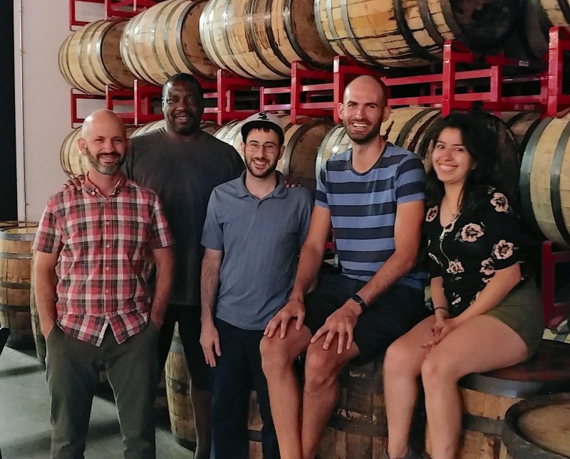 Streetsblog Chicago writers John Greenfield, James Porter, Steven Vance, and Lynda Lopez, plus photographer Jeff Zoline, at RevBrew. Not shown: writers Courtney Cobbs, Igor Studenkov, David Zegeye, and Amber Drea. Photo: A.J. LaTrace
