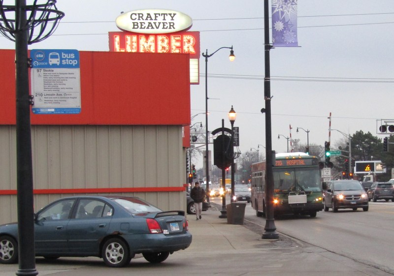 A Route 210 Pace bus arrives at the Oakton-Skokie Yellow Line station. Under Phase II, the route would be eliminated, but the stop would be served by the revamped Route 226, which would continue west of Oakton Street. Photo: Igor Studenkov