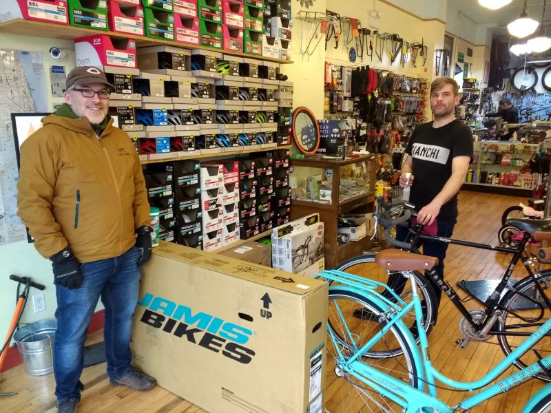 Customer David Leclerk and mechanic Doug Burk are separated by a wall of cycles at Logan Square's Boulevard Bikes. Photo: Kevin Womac