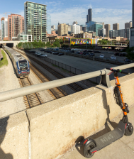 An e-scooter on the Halsted Street bridge over West Loop railroad tracks. Photo: Jonathan Lee