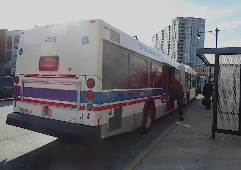 A passenger boards a Clark Street bus through the rear door. Photo: Jeff Zoline