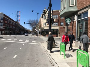 On Lincoln Avenue in Lincoln Square yesterday, the sidewalks were crowded, but the parking lanes were empty. Let's turn parking lanes into pedestrian space. Photo: John Greenfield