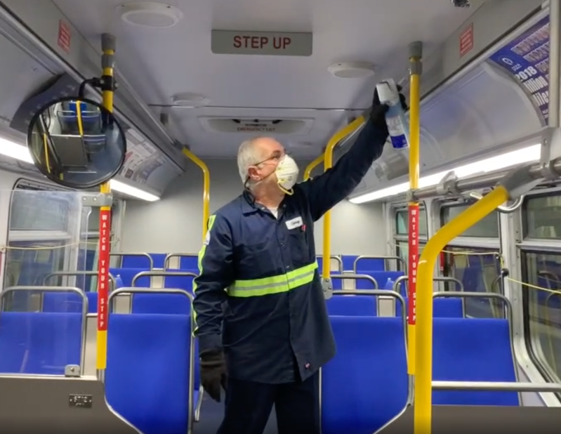 A worker sanitizes a Pace bus. Image: Pace
