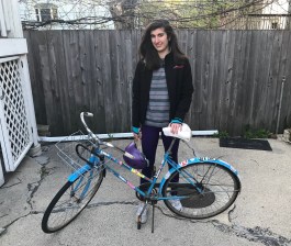 Ariel with her bike, before it was damaged in the crash.