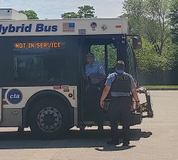 Police officers used the Humboldt Park Boathouse parking lot as a staging area during protests on Sunday. Officers with no face masks were seen entering and exiting a bus staffed by a CTA operator. Photo: Alyssa Iovinelli