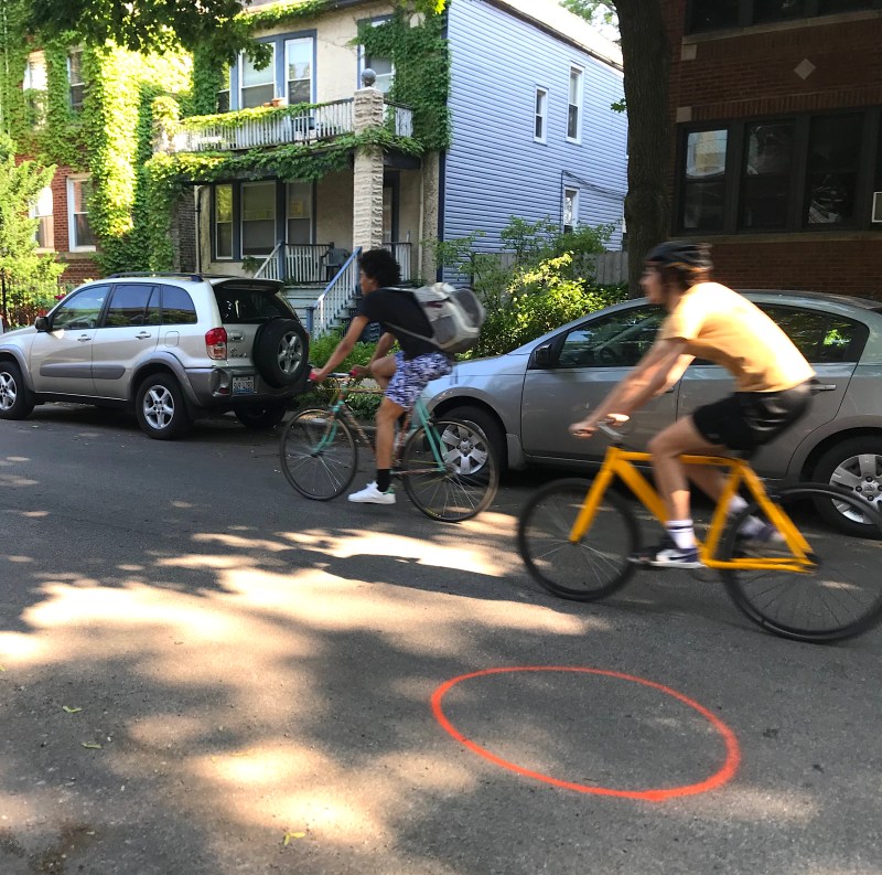 A street marking on Leland west of Western shows where a traffic barrel will be installed tomorrow. Photo: John Greenfield
