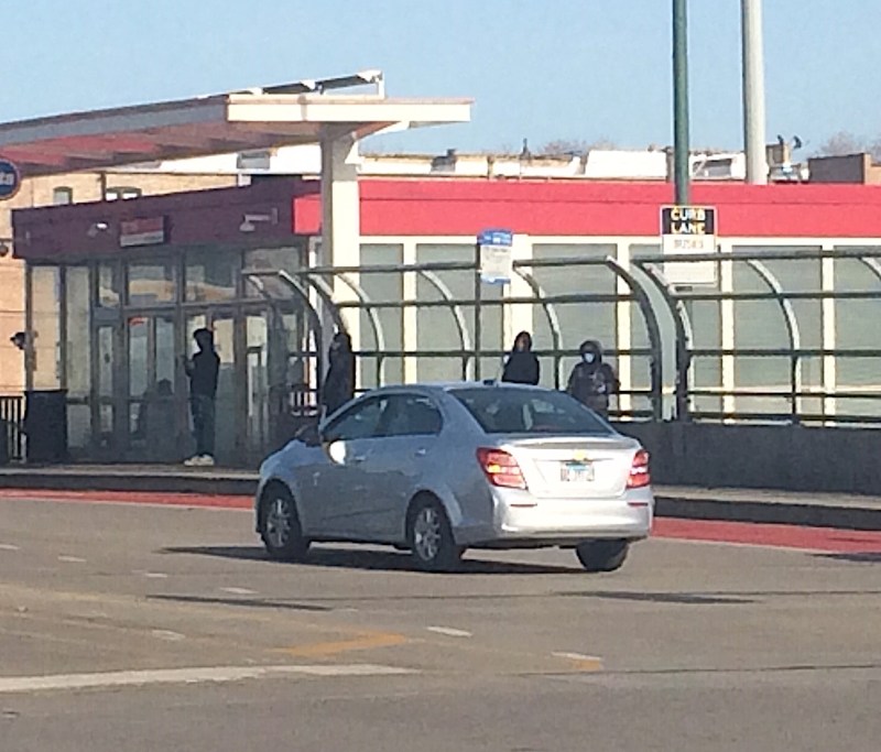 Customers wait for the #79 79th bus at the Red Line station. The line has experienced crowding problems. Photo: James Porter