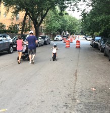 Parents pushing babies and tots riding bikes in the roadway: good signs that a Slow Street is working as intended. Photo: John Greenfield